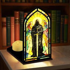 Stained-glass arched book nook display with hooded knight figure and lit candle on base