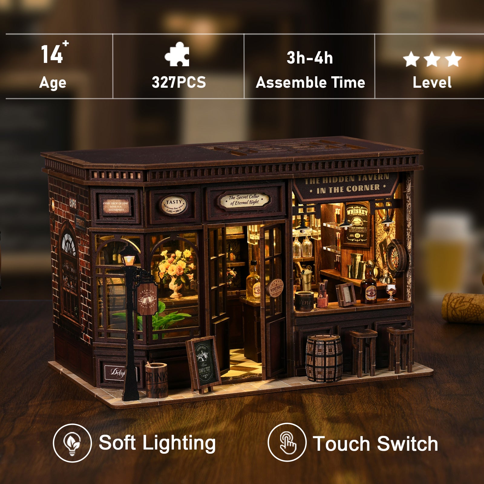 A miniature model of a bar or pub, featuring a wooden exterior, a large window, and various decorative elements such as barrels, bottles, and a sign that reads "The Hidden Tavern in the Corner".