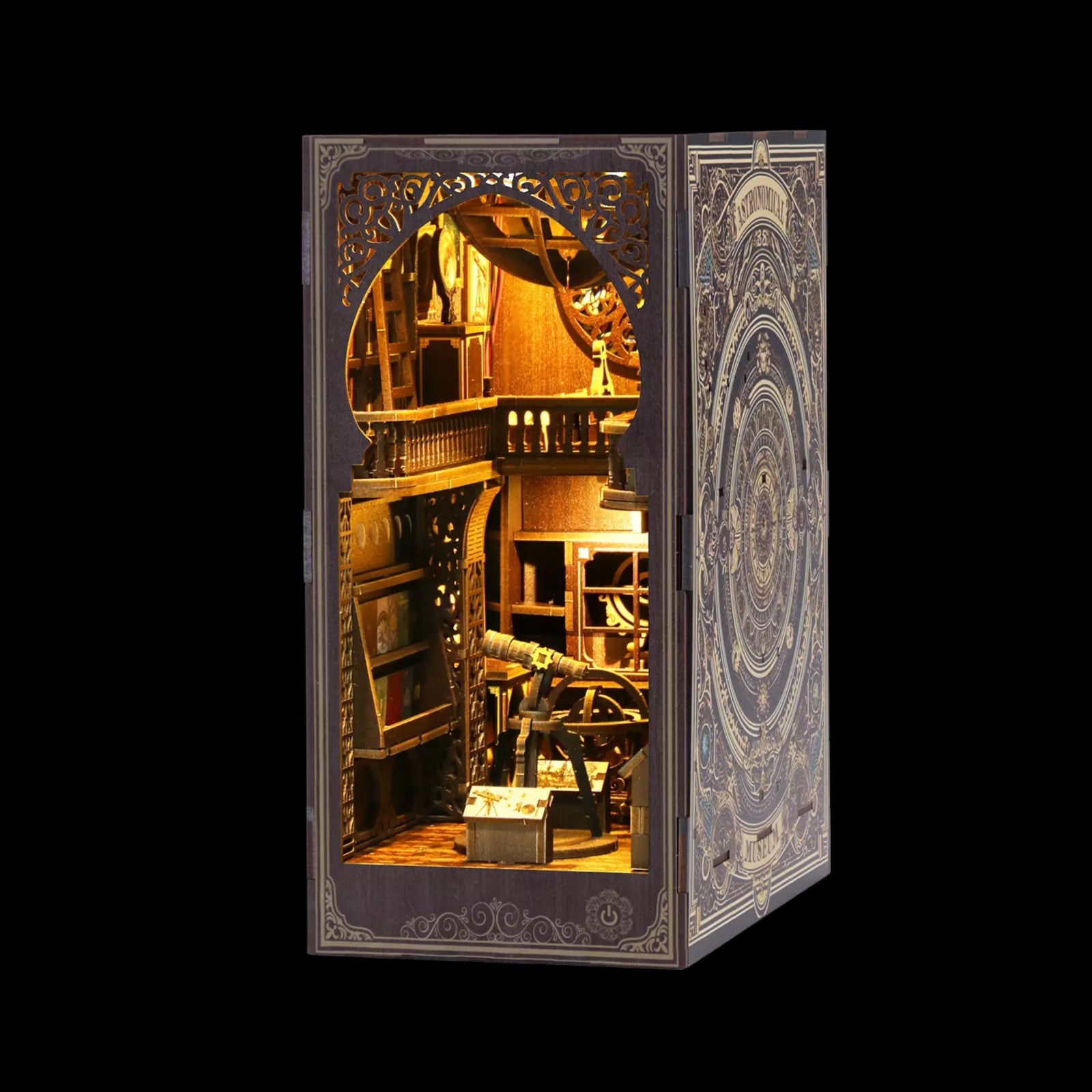A miniature diorama depicting a room with various objects, including a bookshelf, a desk, and a clock, illuminated by a warm, golden light.