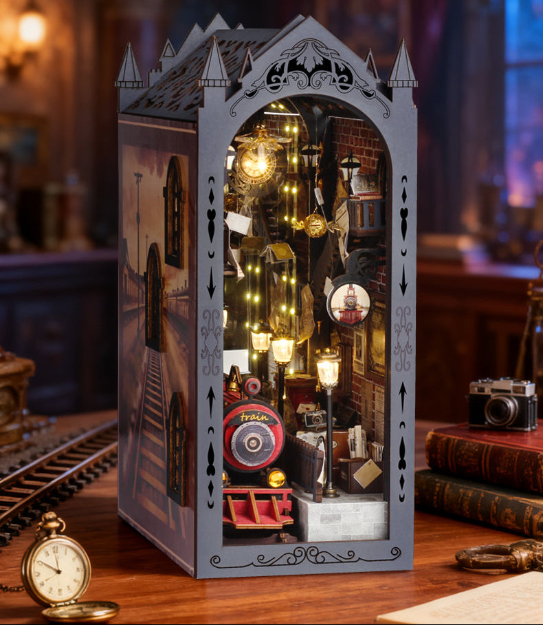 Miniature train book nook kit with upright gothic arch frame and lit train platform