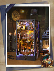 Pirate DIY book nook kit shown open with illuminated miniature ship bookshelf inside