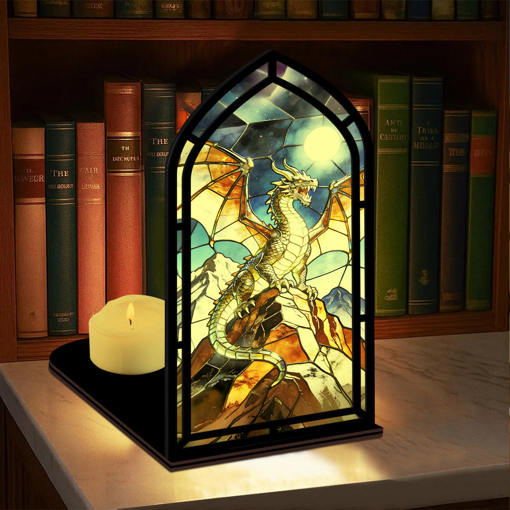 Arched stained-glass dragon display stand with black frame and lit yellow candle