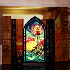 Coastal lighthouse book nook with stained-glass scene and glowing candle
