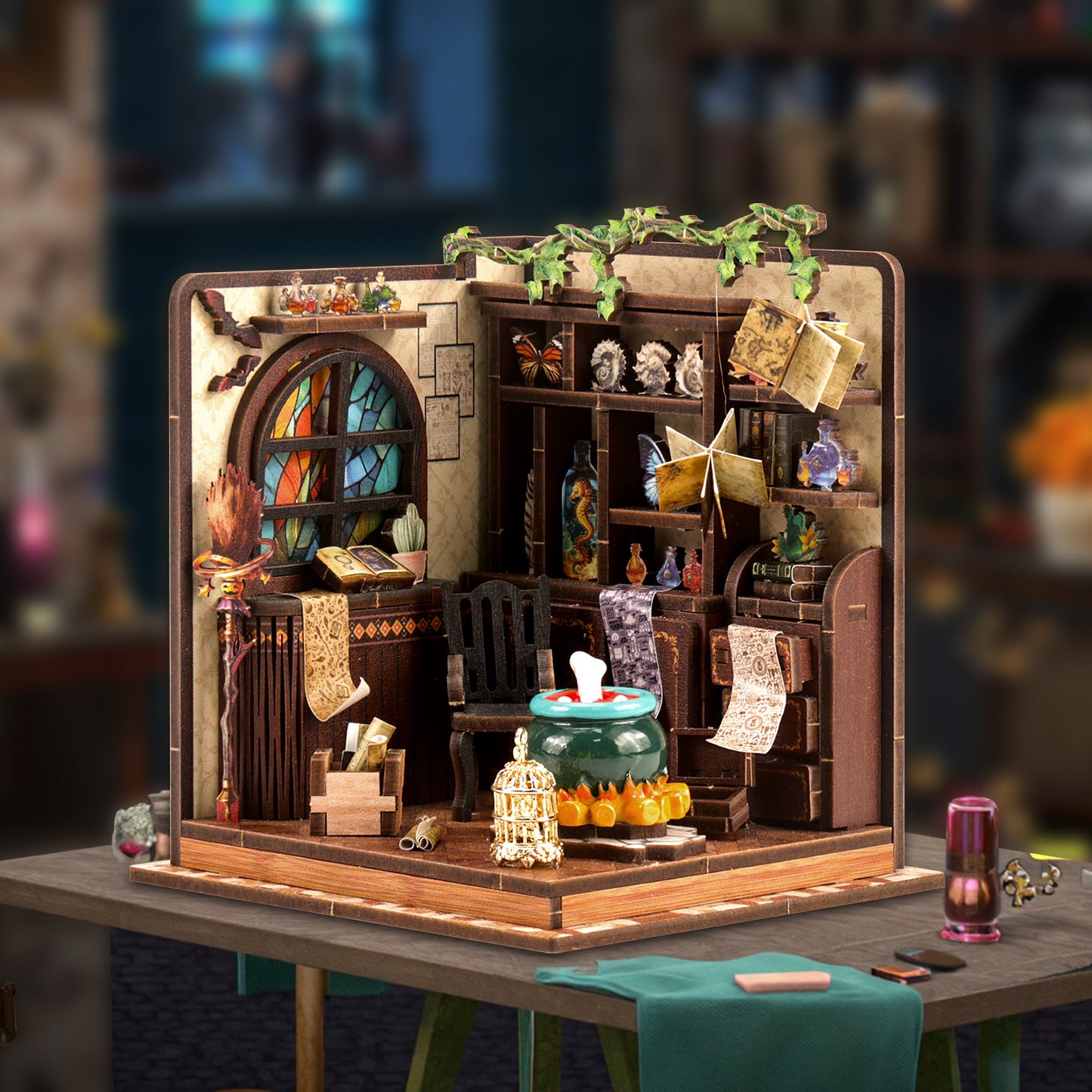 A miniature diorama depicting a quaint, whimsical room with various objects and decorations, including a stained glass window, bookshelves, and a small birdcage.