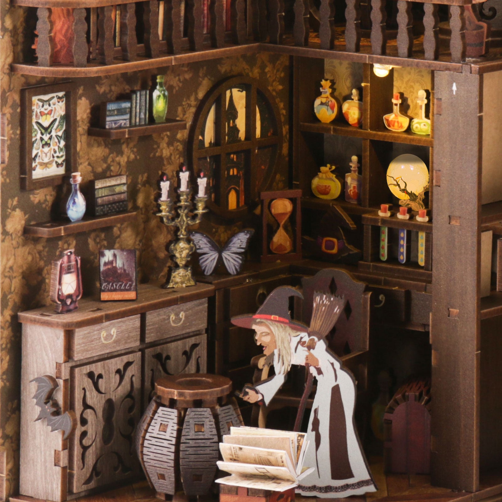 Wooden book nook diorama with arched doorway, potion bottles, and a librarian figure