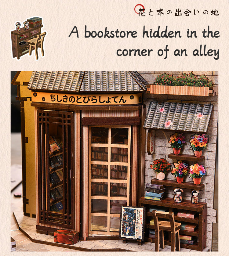 A miniature dollhouse with a small library, featuring a bookshelf, doll decoration, and potted plants.