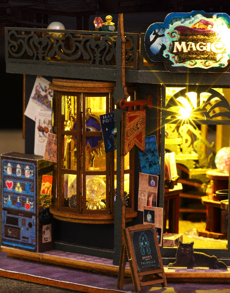 Miniature side wall with lit door, posters, and glowing streetlamp lights on the base
