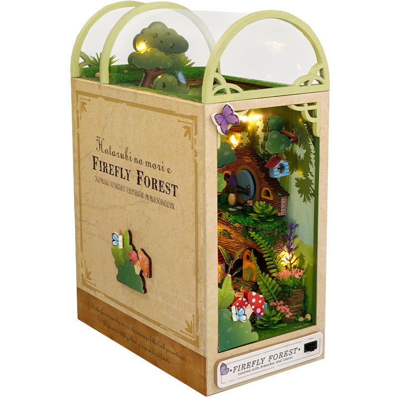 Wooden DIY book nook kit with arched top window, glowing miniature forest inside