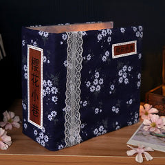 Dark blue fabric gift box with white cherry blossom pattern and lace trim