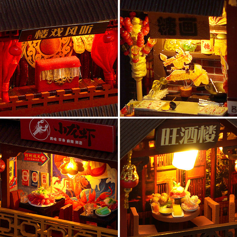 Miniature book nook kit close-up of lit stall awnings, signage, and food display trays