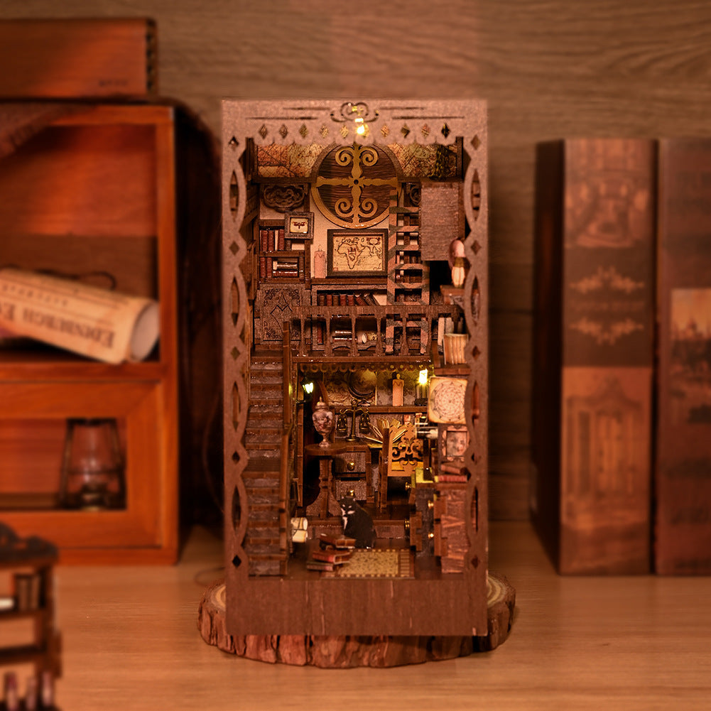Wooden mini book nook front view with ornate arch and warm lit book shelves
