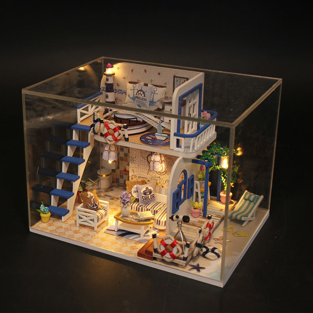 DIY miniature craft kit dollhouse with blue accents, furniture and warm lights