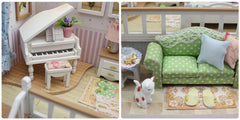 Miniature dollhouse room kit close-up of white piano and green sofa with pillows