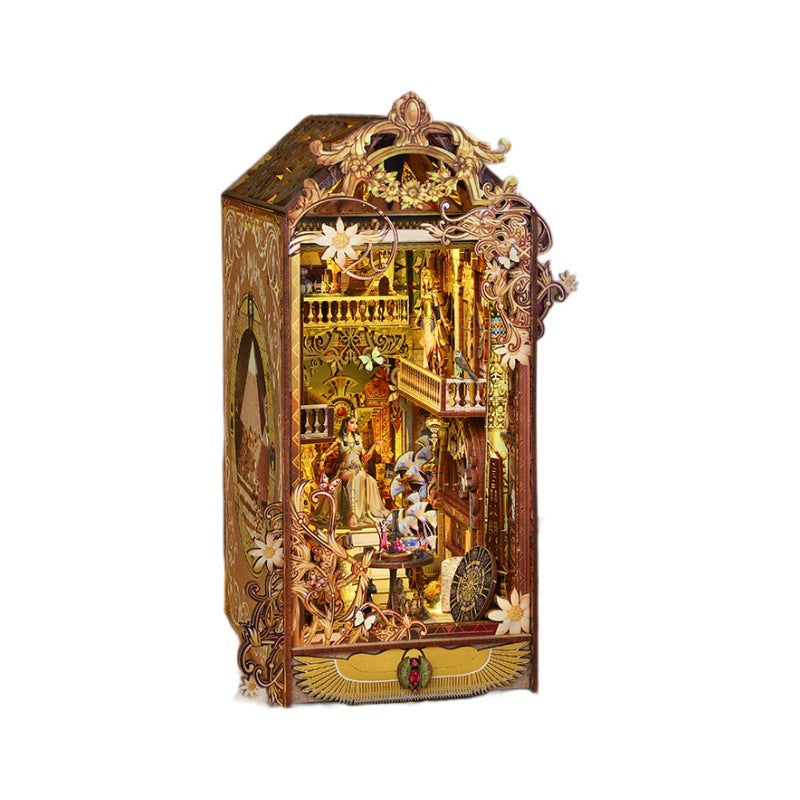 Ornate golden-brown wooden book nook miniature with open front and decorative frame