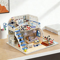 DIY miniature craft kit dollhouse with blue railings, balcony stairs, patio table, and warm lamp