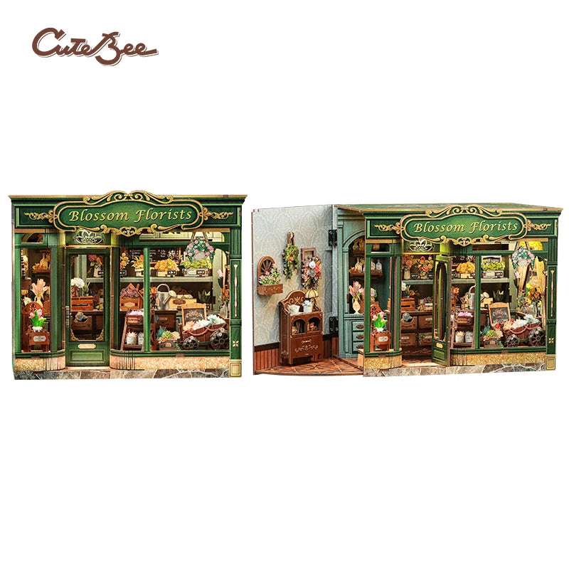 Miniature 3D wooden book nook storefront with green facade and flower-decor sign