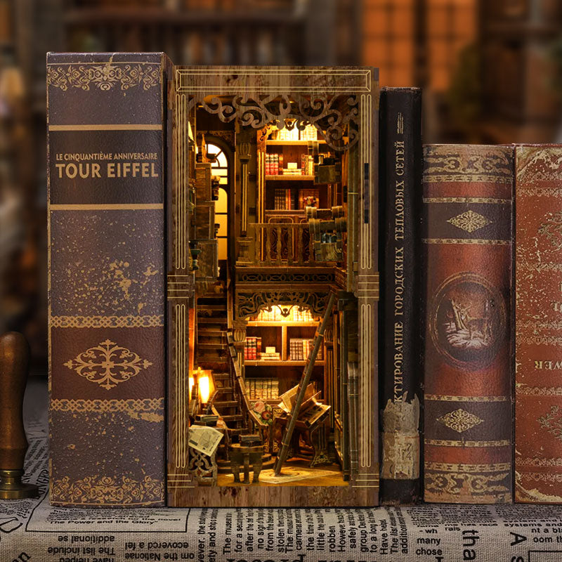 A miniature model of a library with bookshelves and a small window, creating a cozy and inviting atmosphere.