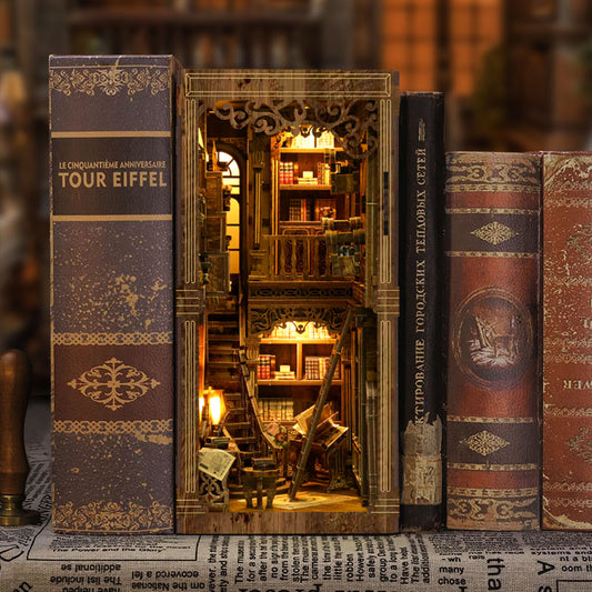 A miniature model of a library with bookshelves and a small window, creating a cozy and inviting atmosphere.