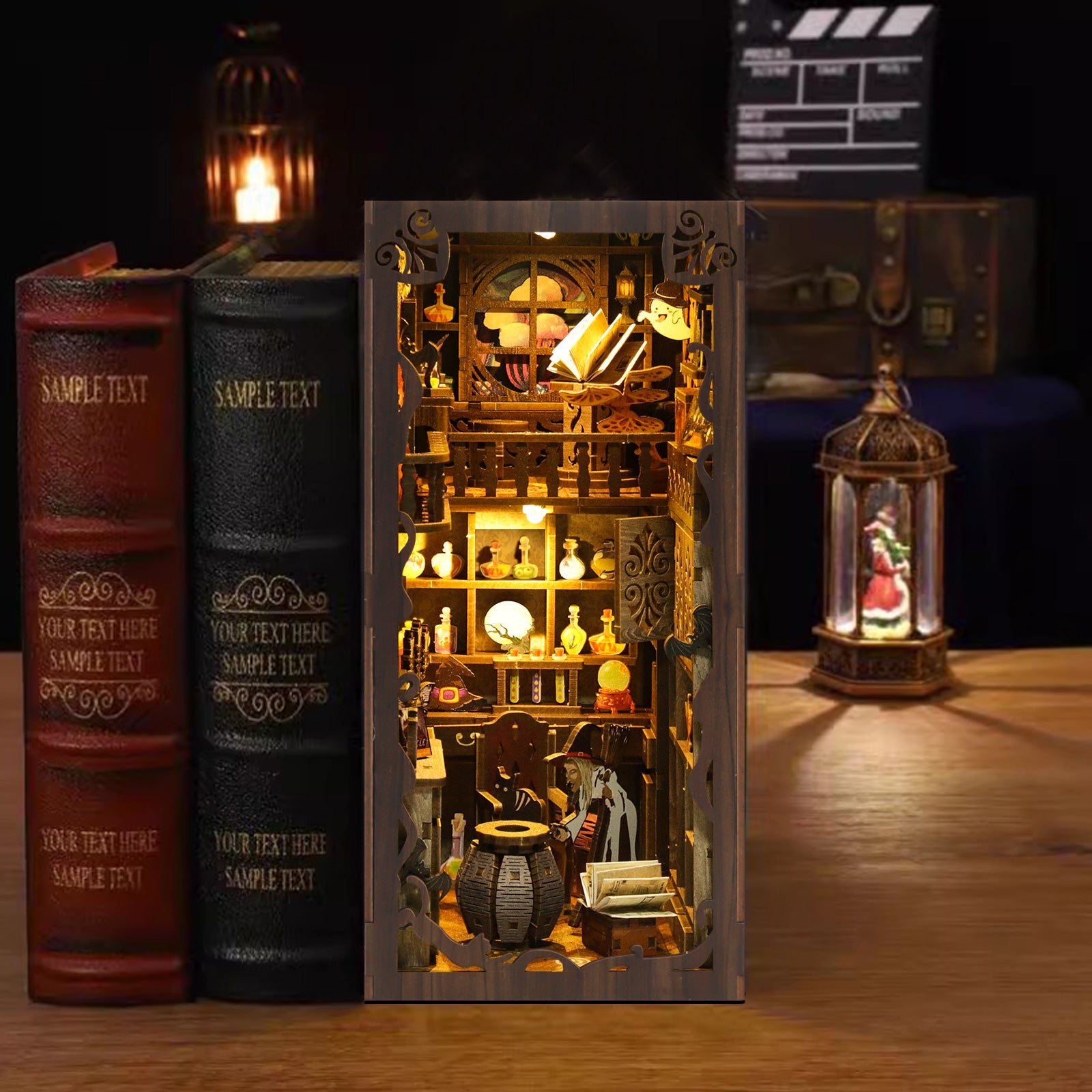 A miniature diorama of a small shop or laboratory, with various objects and decorations inside, is displayed in front of two books. The scene is illuminated by a lantern, creating a warm and inviting atmosphere.