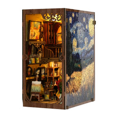 Book nook kit with open cabinet doors showing miniature room and warm interior light