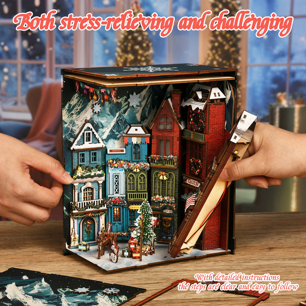 DIY book nook kit open with miniature Christmas street corner buildings on base