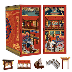 DIY book nook kit box with included mini parts: gate, roof, arched bridge, and figures