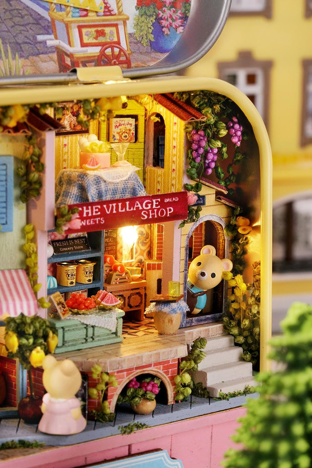 Miniature Lucky Market tiny shop view through open tin top, front awning and bunny figure.