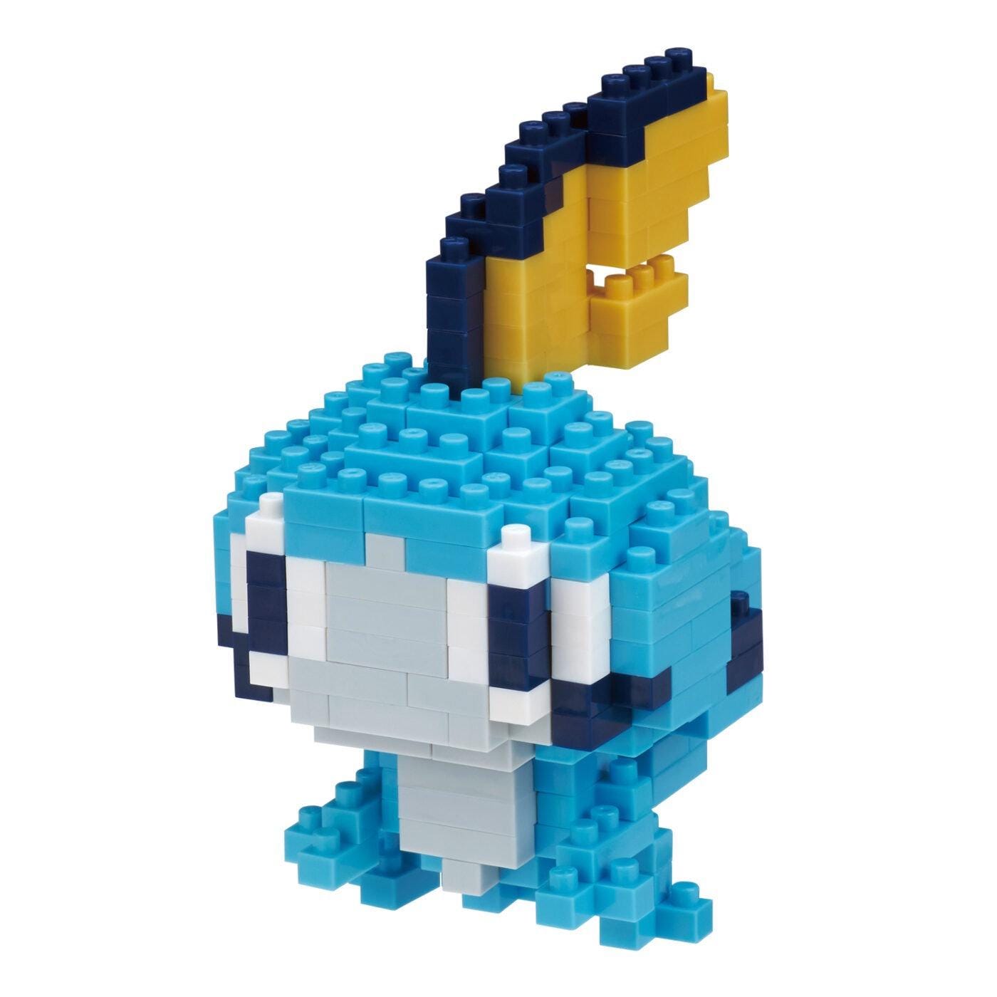 A blue and yellow pixelated character made of small blue and yellow blocks, resembling a pixelated character from a video game.