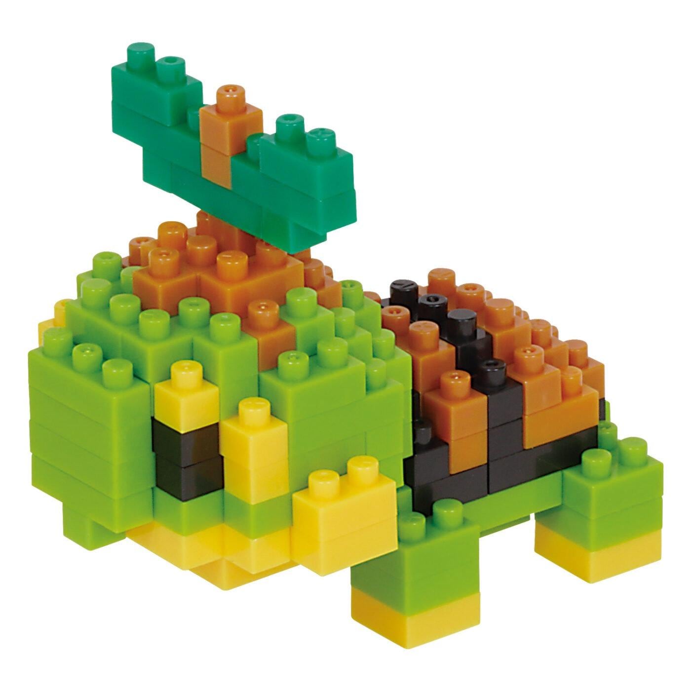 A colorful toy made of various building blocks in different shapes and colors, including green, orange, and yellow.