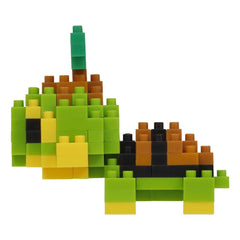 A colorful toy turtle made of small building blocks in various shades of green, yellow, and brown.