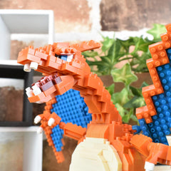A close-up of a colorful, orange and blue LEGO dragon-like figure made up of numerous small bricks.