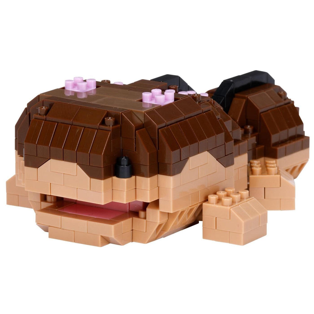 A toy made of small brown and beige building blocks, resembling a small animal or sea creature.