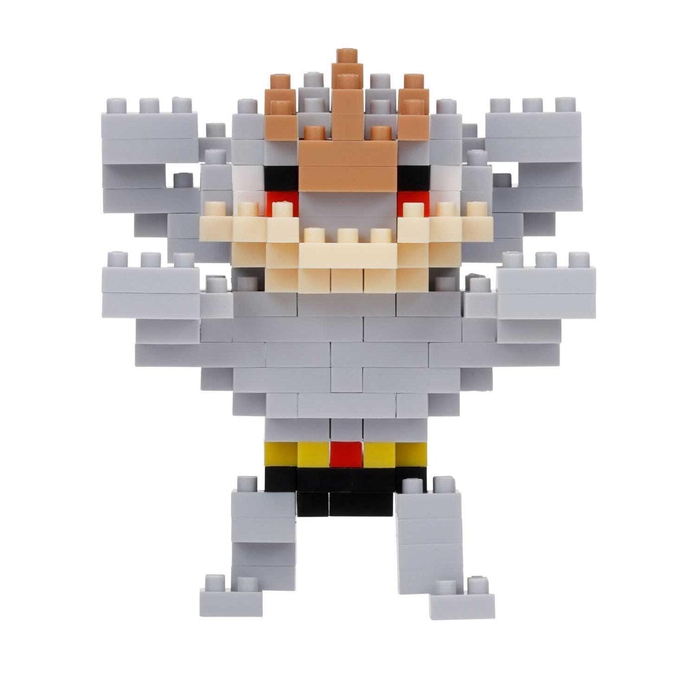 A pixelated toy figure made up of various gray and brown blocks, resembling a character or monster.
