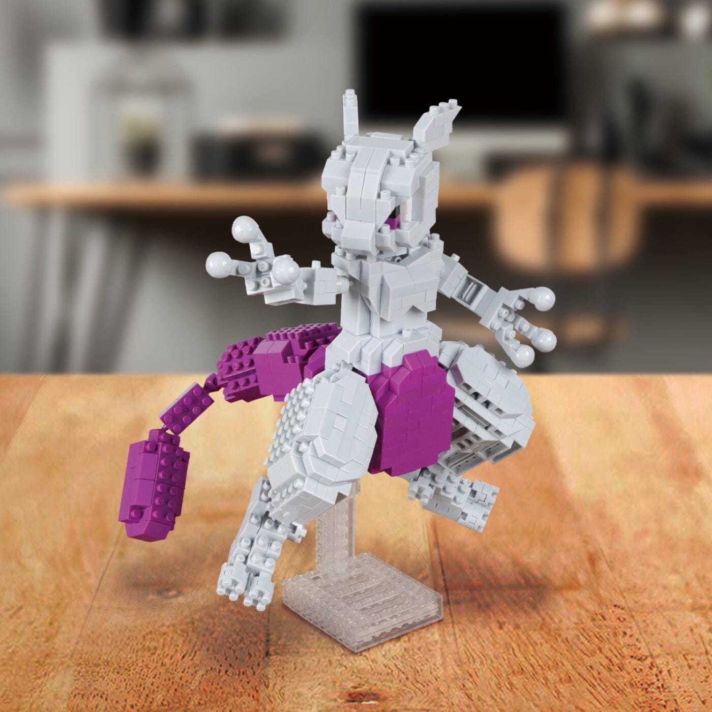 A LEGO figure of a character from the Pokémon franchise, specifically Pokémon, is displayed on a wooden surface.