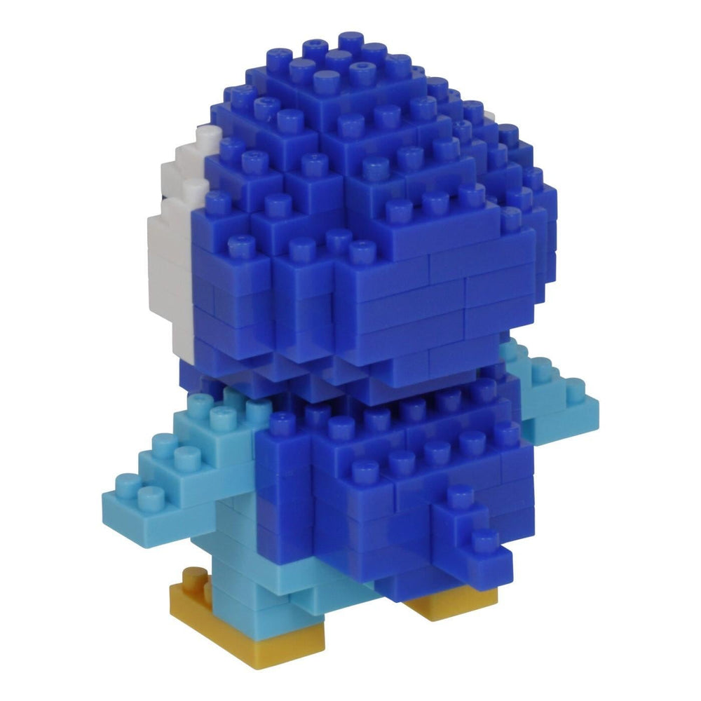 A blue and white penguin-shaped building block toy made of numerous small blue and white blocks.
