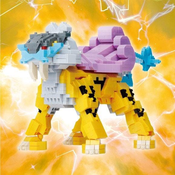 A colorful, 3D-built toy resembling a dragon or mythical creature, with a mix of yellow, purple, and gray colors. The toy appears to be made of small, colorful blocks, giving it a playful and imaginative appearance.