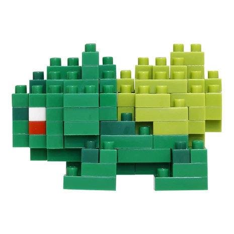 A collection of green and yellow building blocks arranged in various shapes and sizes, creating a playful and colorful composition.