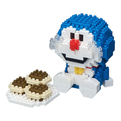 A blue and white Lego figure of Doraemon, a popular character from the anime series, is sitting next to a stack of Lego bricks.