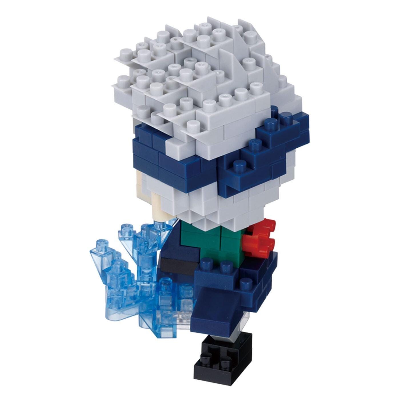 A toy figurine made of various colored building blocks, including blue, gray, and red, with a stylized design.