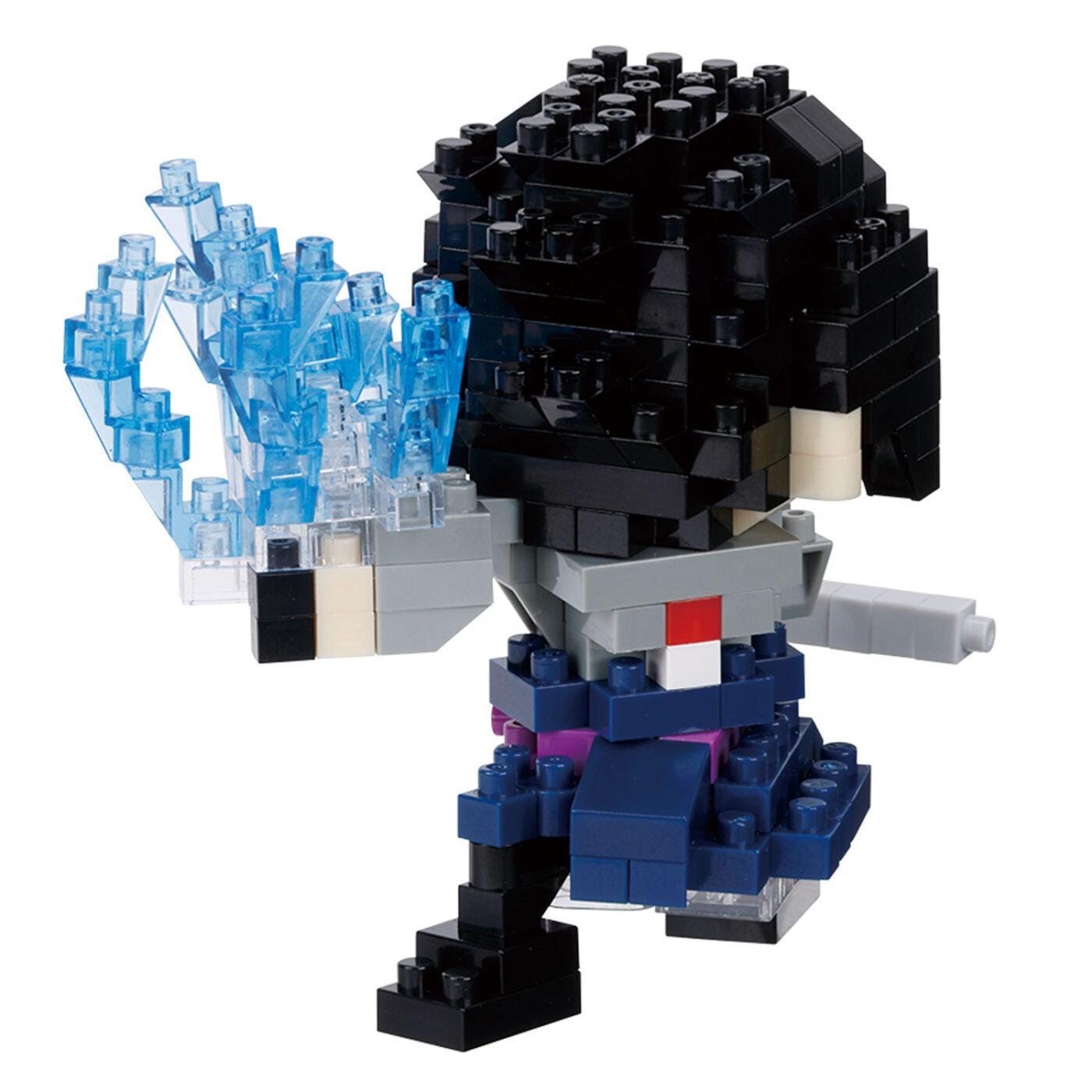 A toy figurine made of small building blocks in various colors, including blue, black, and gray. The figurine appears to be a character or action figure, possibly inspired by a popular video game or anime.