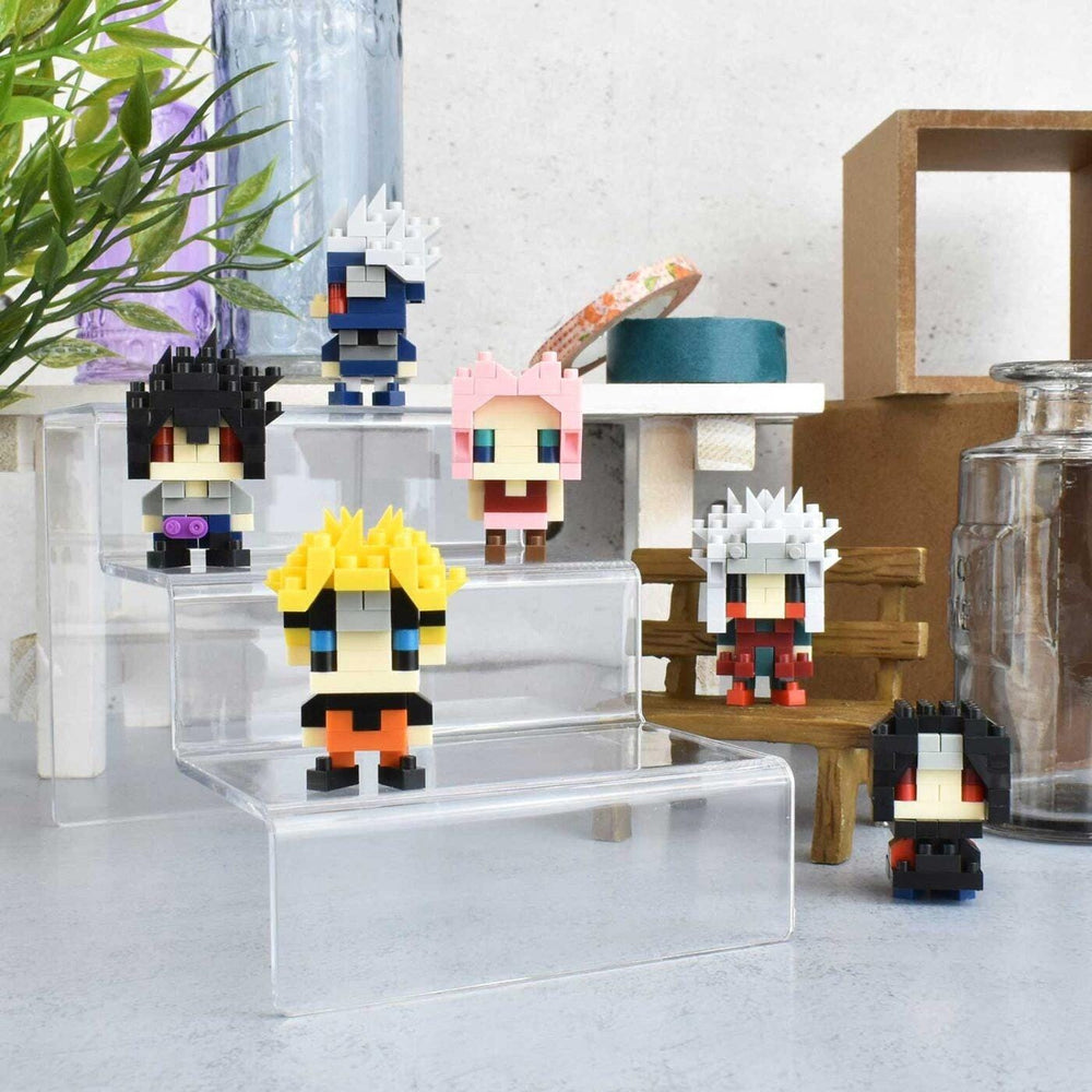 A collection of colorful, pixelated figurines or characters displayed on a shelf or table, with various accessories and decorative items in the background.