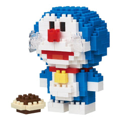 A blue and white Lego figure of Doraemon, a popular character from the Doraemon franchise, is shown next to a small Lego cake.
