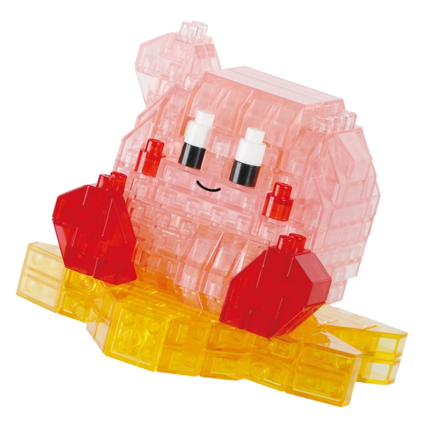 A pink and yellow 3D-printed toy figure with a smiling expression and red accessories.