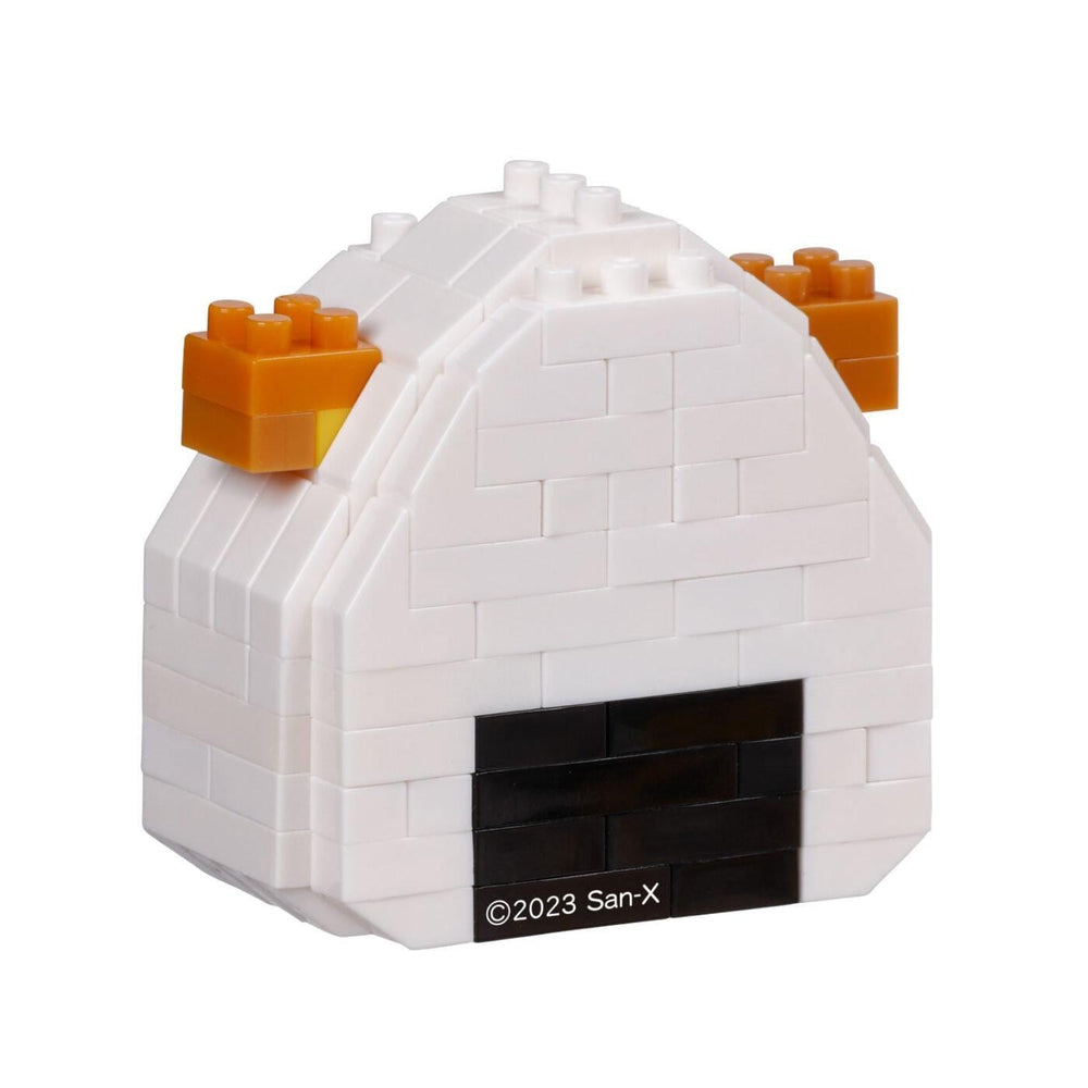 A white and black Lego structure with orange Lego bricks on top.