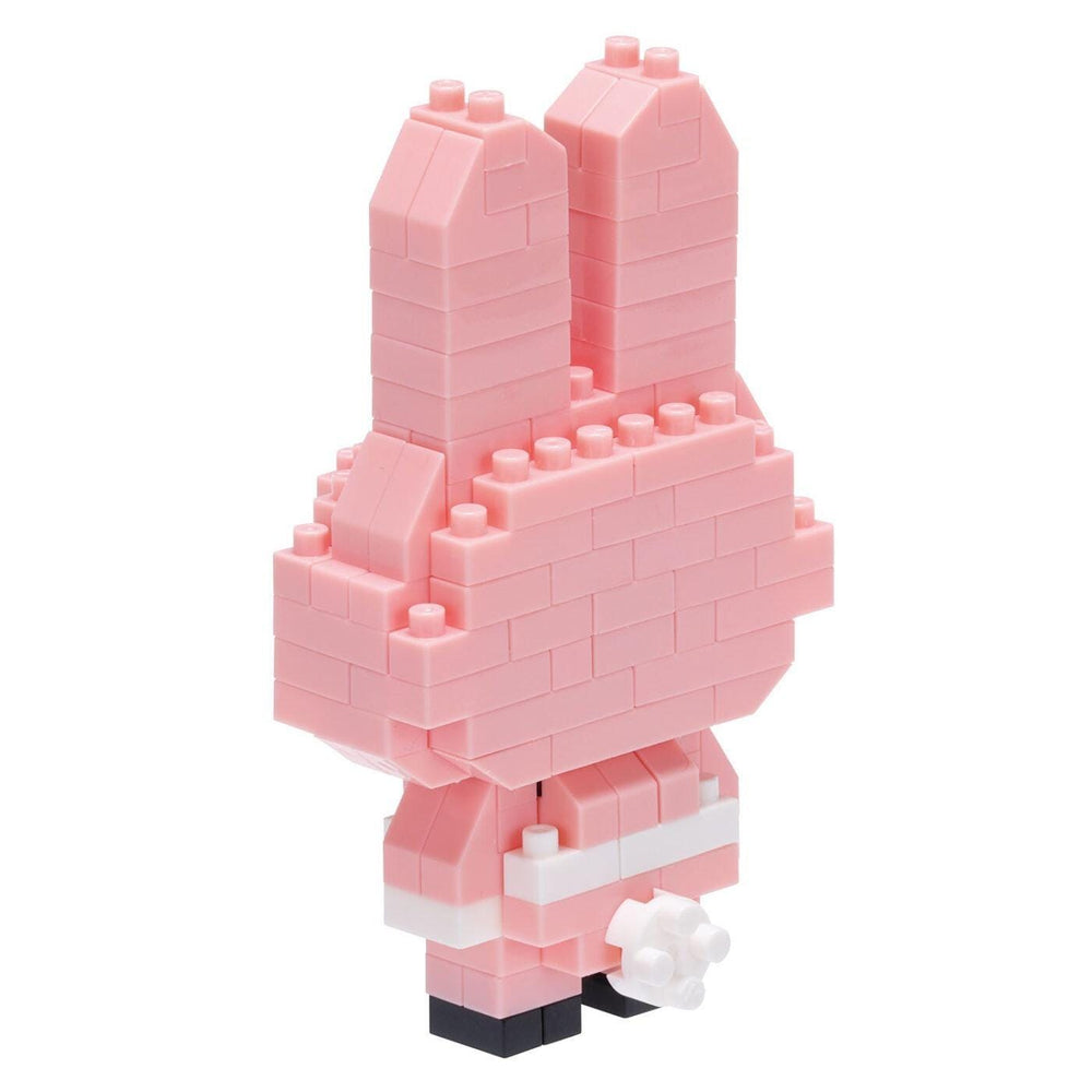 A pink, brick-like toy figure made of small, pink building blocks.