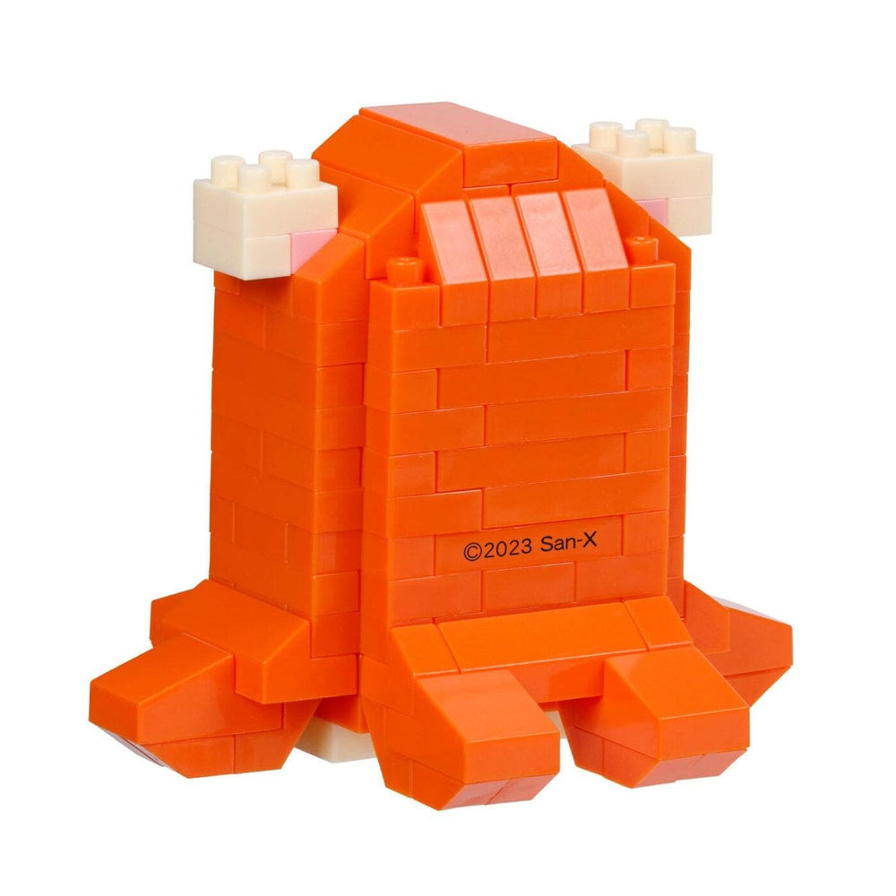 An orange Lego dinosaur-shaped object made up of numerous small Lego bricks.