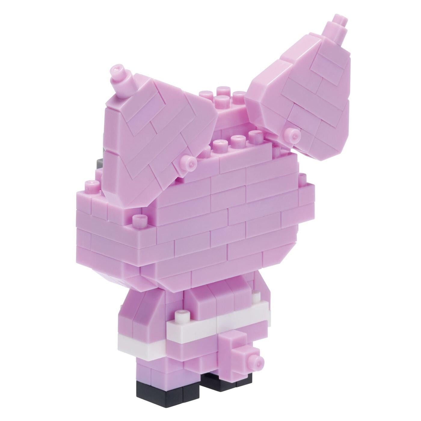 A pink, brick-like toy figure with two large ears and a small head, composed of numerous small bricks.