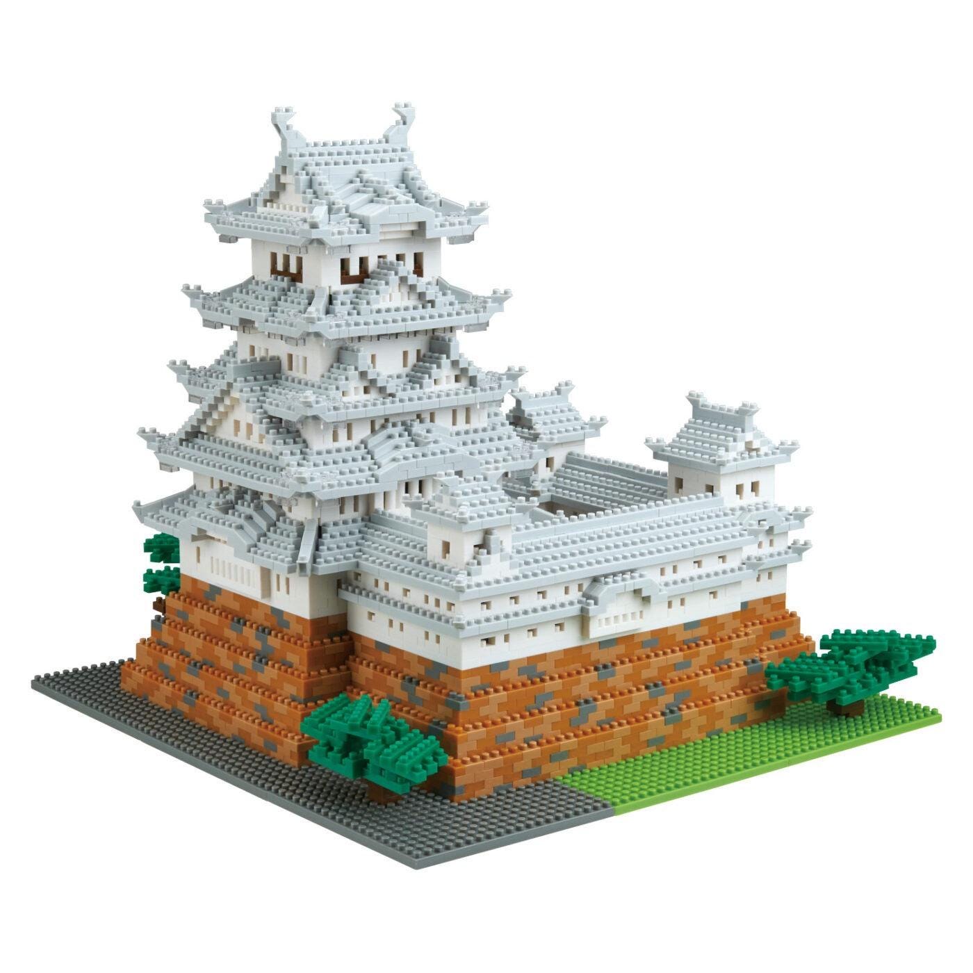 A detailed model of a traditional Japanese castle or pagoda, composed of numerous small, interlocking bricks in various colors.