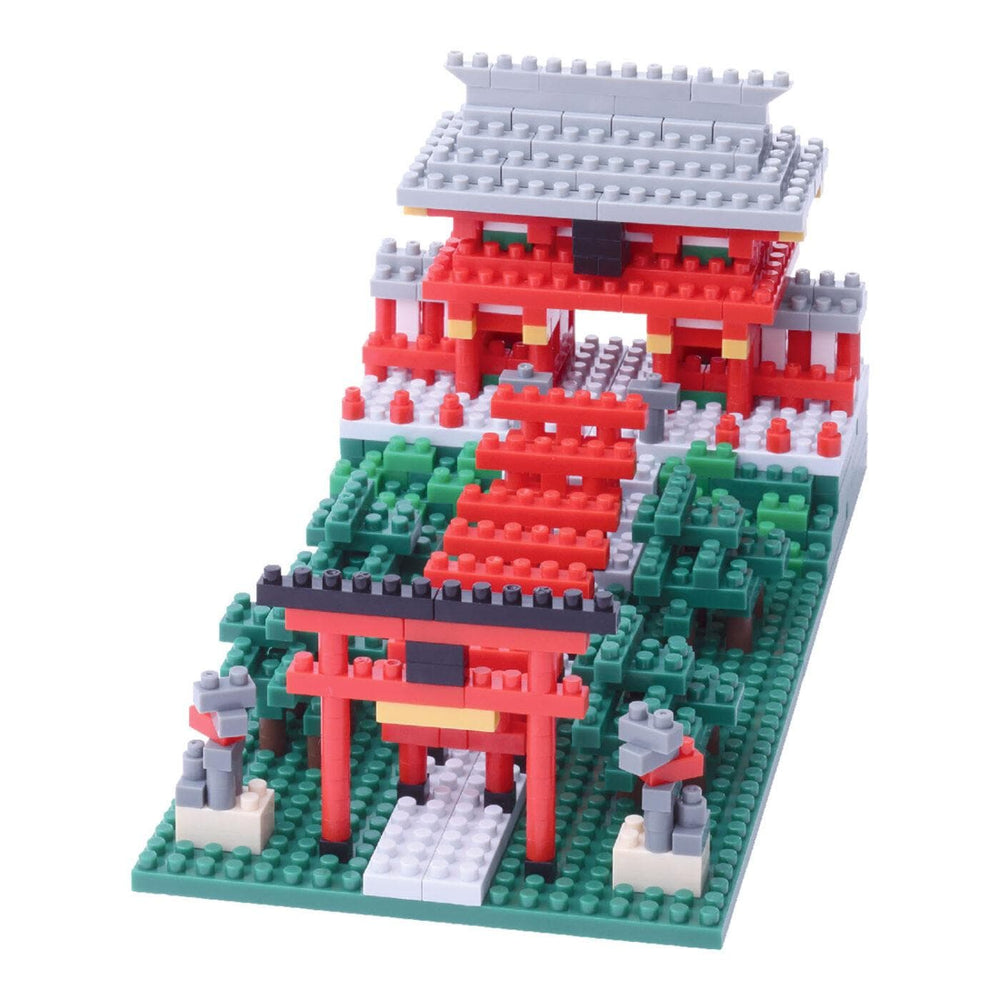 A colorful toy model of a Japanese-style temple made of building blocks, featuring red and green colors and intricate details.