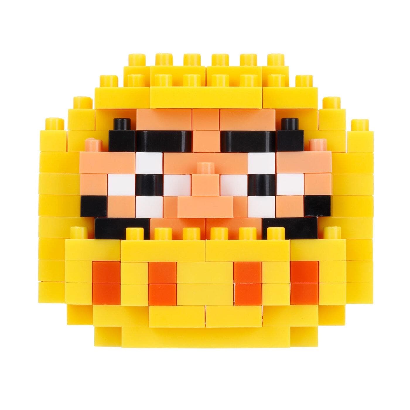 A colorful, pixelated face made up of yellow and orange blocks, resembling a pixelated character or design.